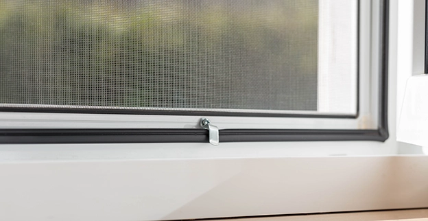 A closeup of a window screen.