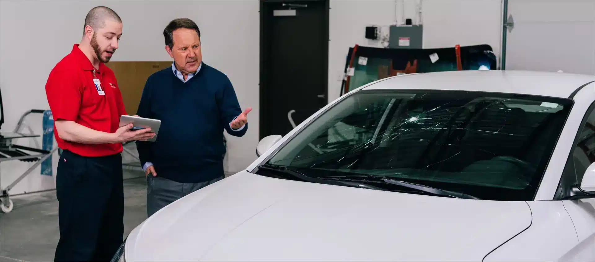Glass Doctor technician preparing a new windshield for windshield replacement.