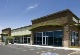 Commercial building with large glass windows for business glass repair and replacement.