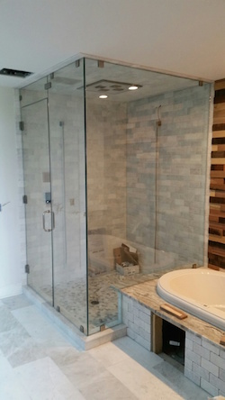 hexagonal framed shower enclosure with thick glass and swinging door