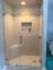 Small custom low iron glass shower door with white and grey interior
