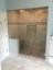 Marbled steam room with glass door installation enclosure