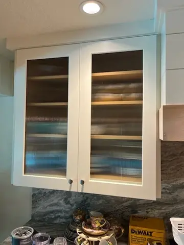 Cabinet with textured glass inserts installed by Glass Doctor of Ocala.