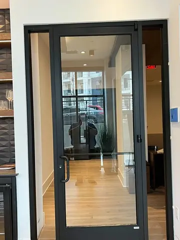 An interior office glass door with glass side panels installed by Glass Doctor of Nashville.
