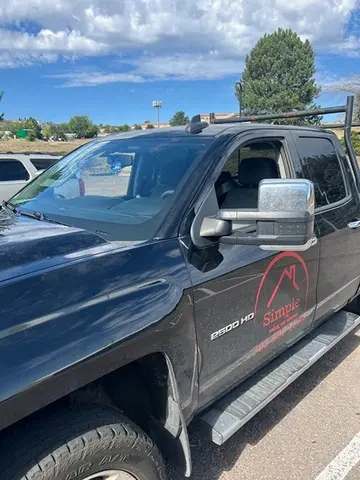 A black commercial work truck with a newly installed windshield by Glass Doctor Auto of Castle Rock.