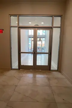 An office building interior glass door with glass panels around it by Glass Doctor of Nashville.
