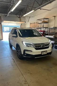 A white SUV sitting in the work bay at Glass Doctor Auto of Castle Rock.