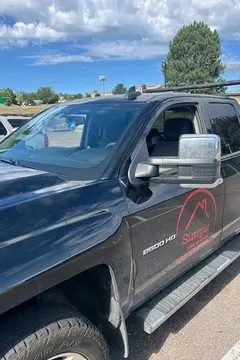 A black commercial work truck with a newly installed windshield by Glass Doctor Auto of Castle Rock.