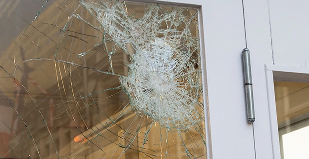 A Broken glass door.