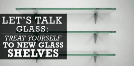 Three minimalist glass shelves mounted on a wall.