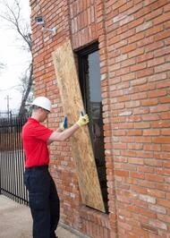 Glass doctor technician repairing a door.