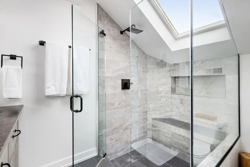Walk-in shower with skylight.
