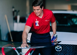 Glass Doctor professional cleaning car windshield.