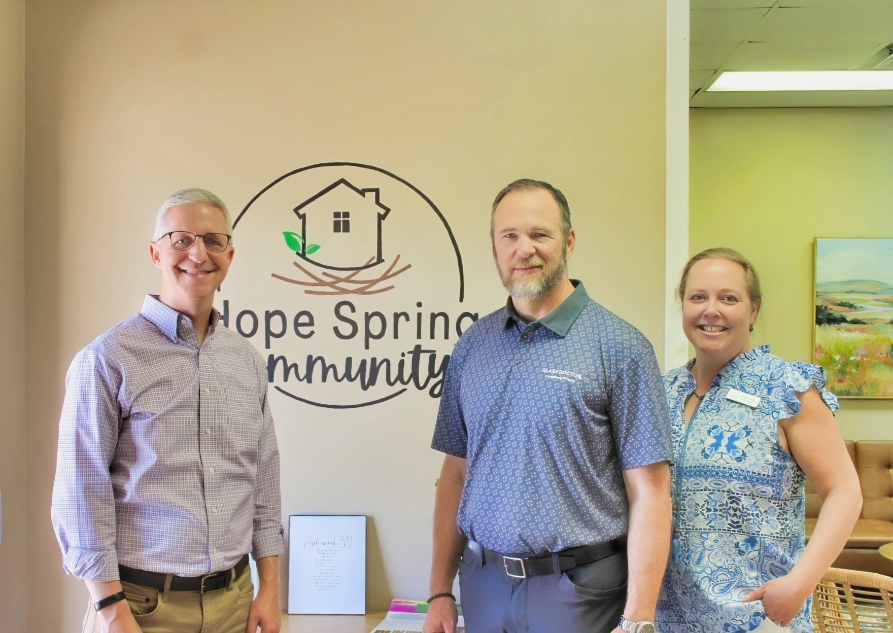 Larry Patterson alongside the owners of Hope Springs Community