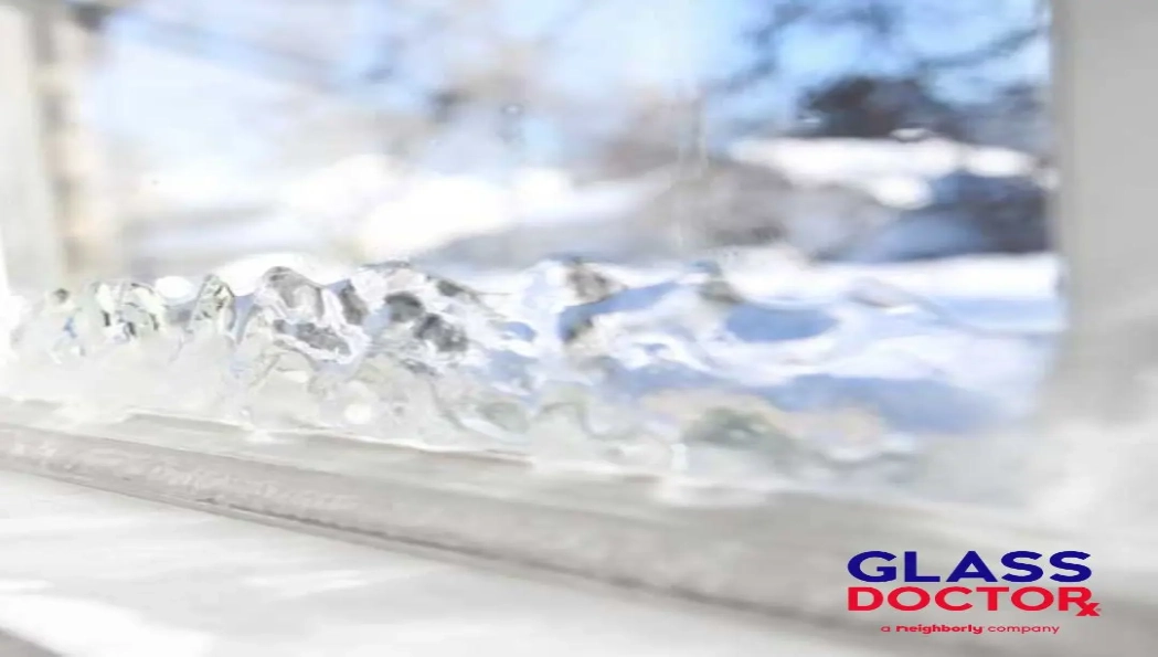 Ice buildup on residential window showing cold air drafts in a Boise Idaho home during winter