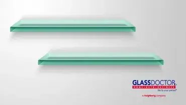 Two glass shelves on a wall