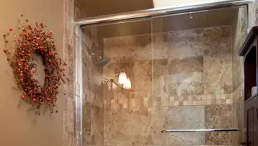 Framed sliding glass shower door