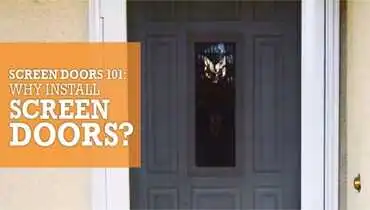 A screen door with white trim in front of a grey front door