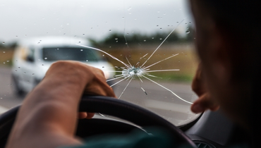 Driver view of damaged, cracked windshield