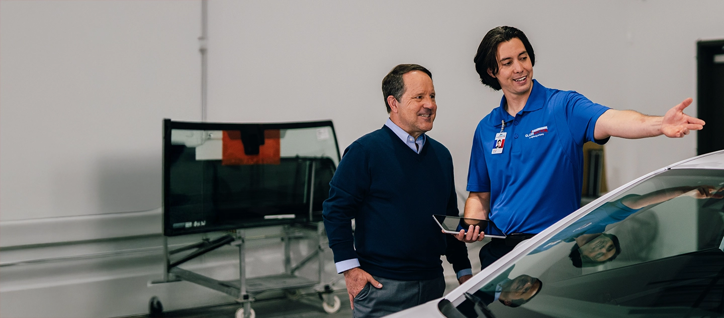 Glass Doctor professional talking with customer.